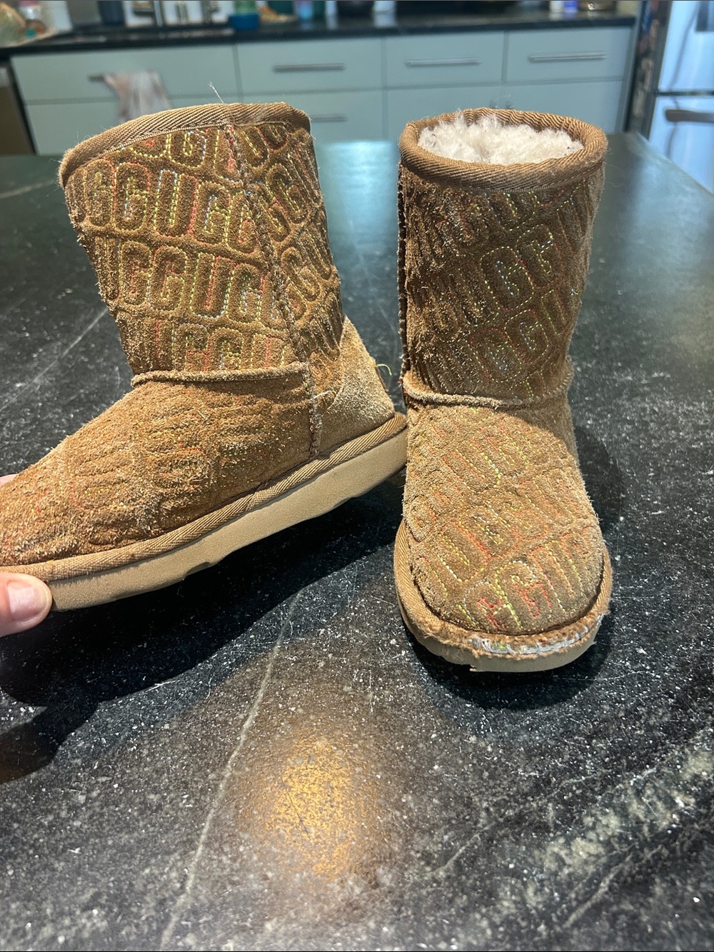 Kids Tan Uggs with rainbow logo stitching